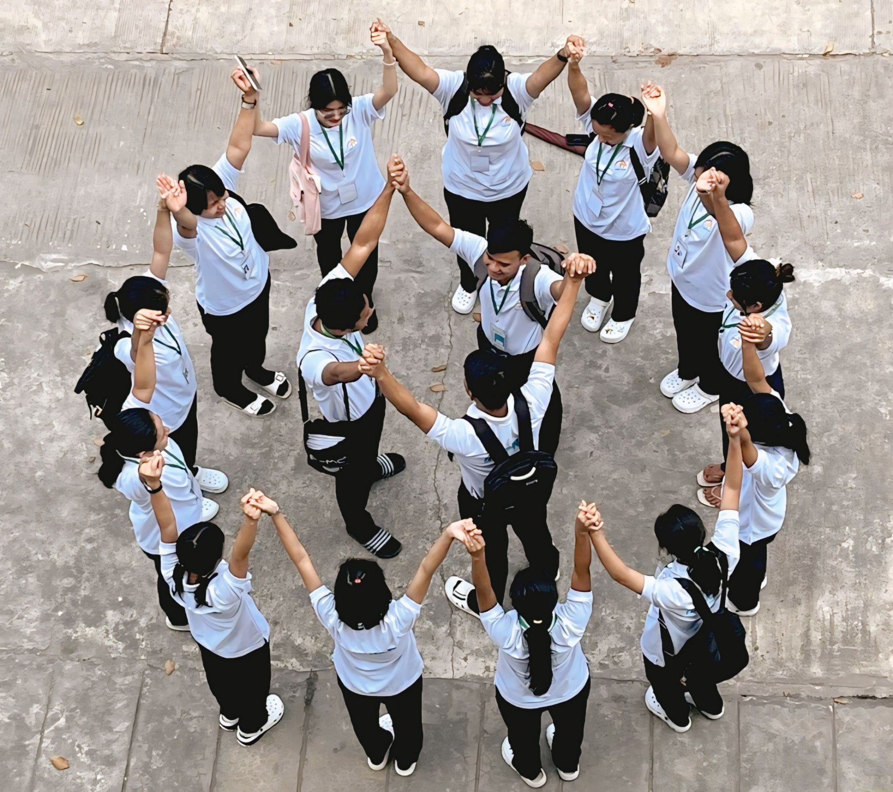 A professional Japanese instructor gesturing toward a chalkboard